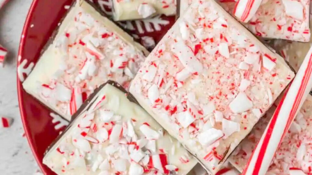 Peppermint bark placed on a red plate.