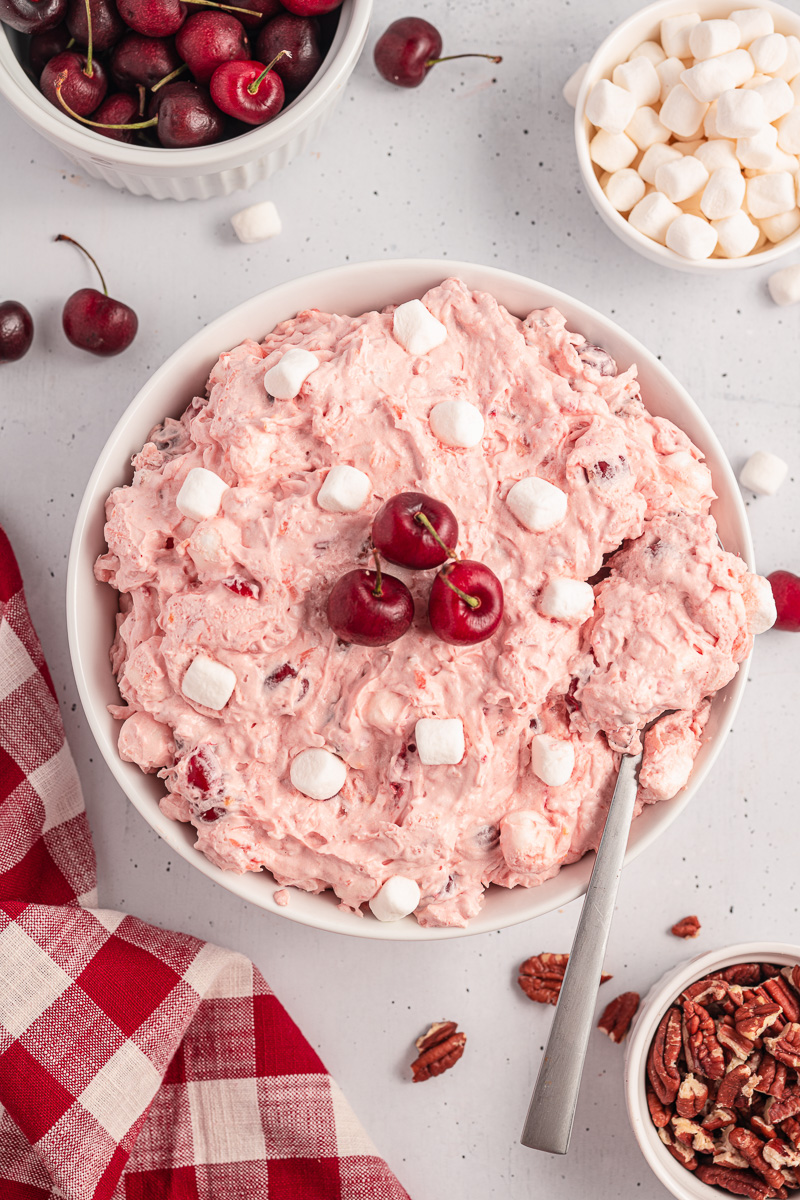 Cherry fluff salad in a white bowl.