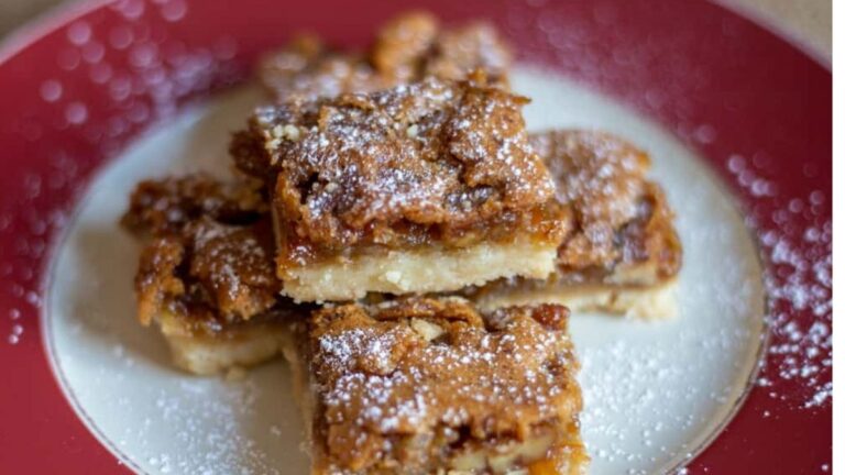 Pecan butter tart bars on a plate.