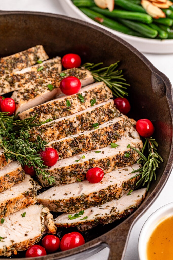 Oven roasted turkey tenderloin in skillet.