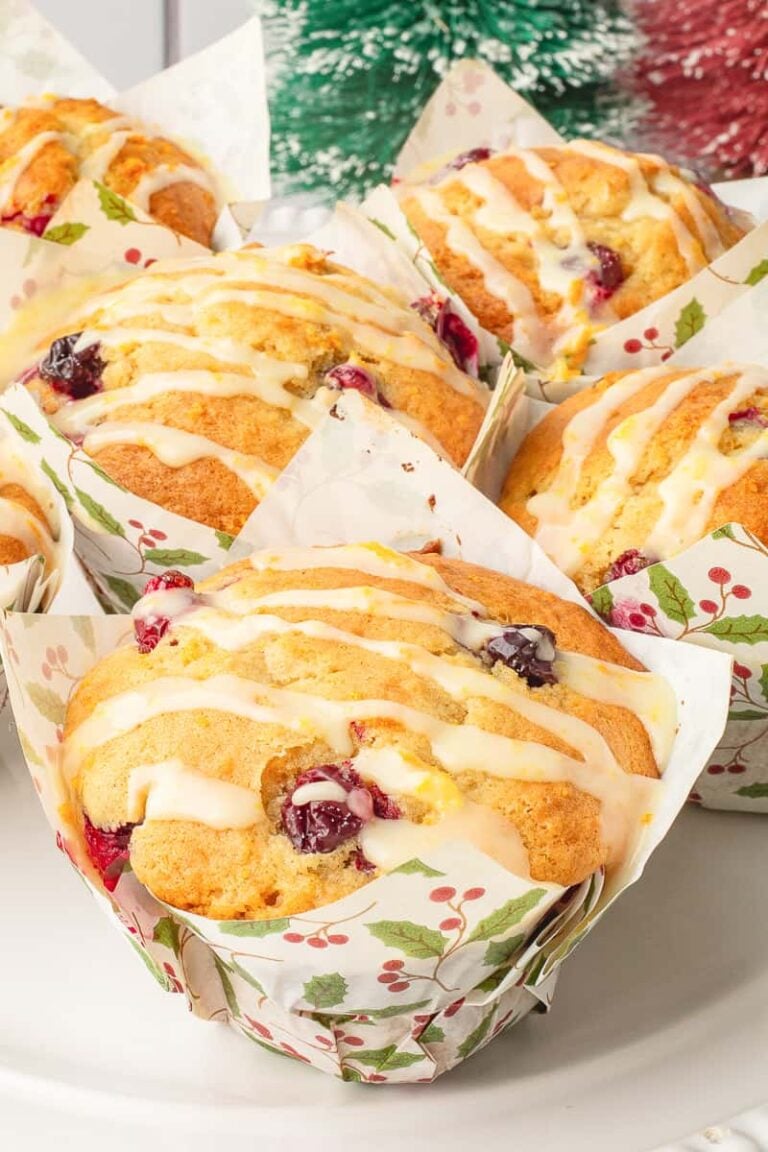 Cranberry orange muffins on a board.