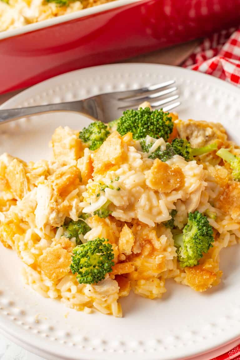 Chicken broccoli rice and cheese casserole on a white plate.