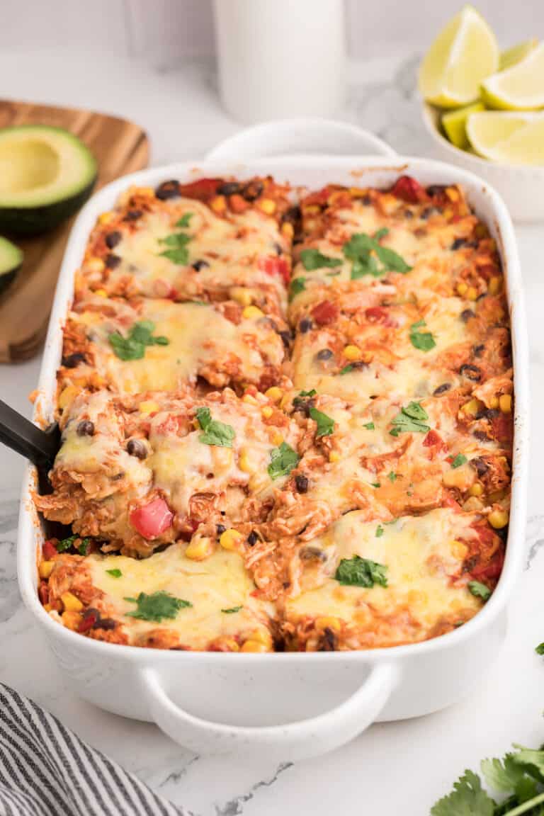 Chicken enchilada casserole in baking dish, ready to be served.