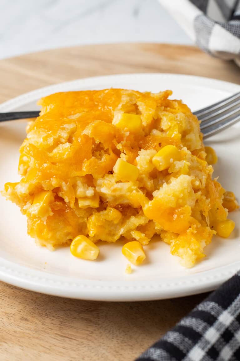Corn casserole on a white plate.
