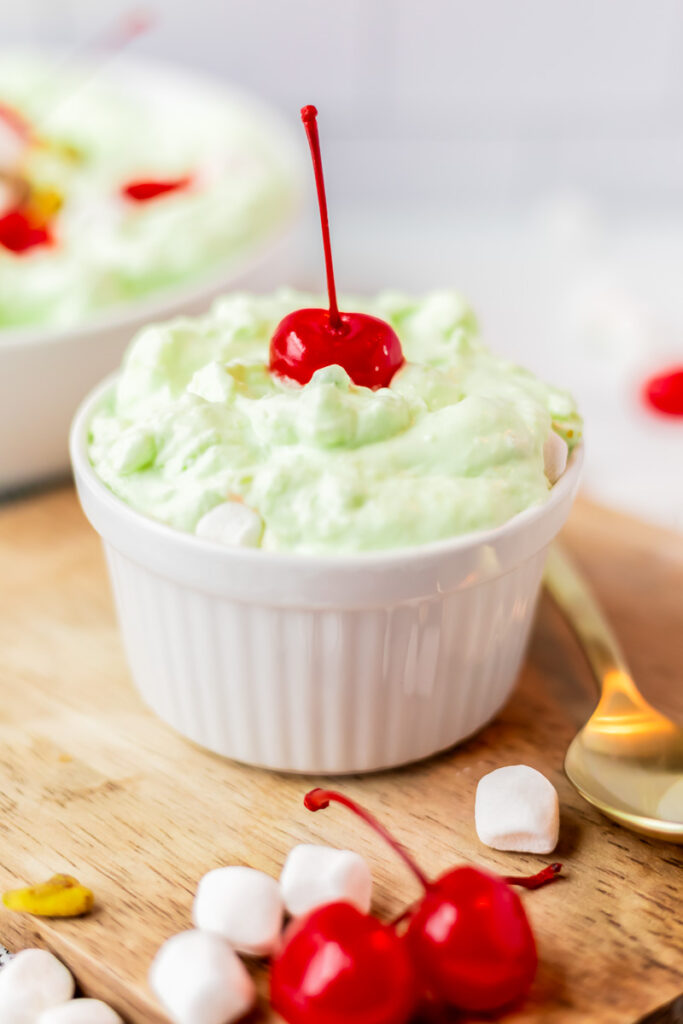 Watergate salad served in small white bowl.