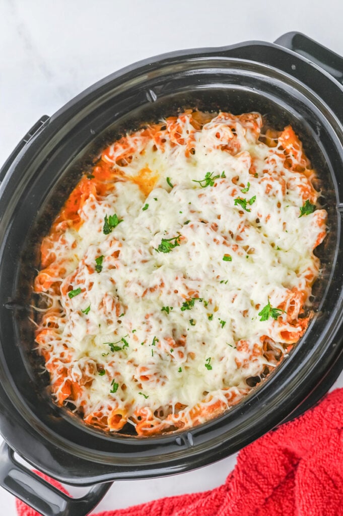 Crockpot baked ziti with mozzarella cheese on top.