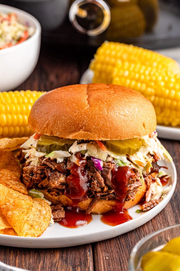 Beef brisket sandwich with BBQ sauce and coleslaw.
