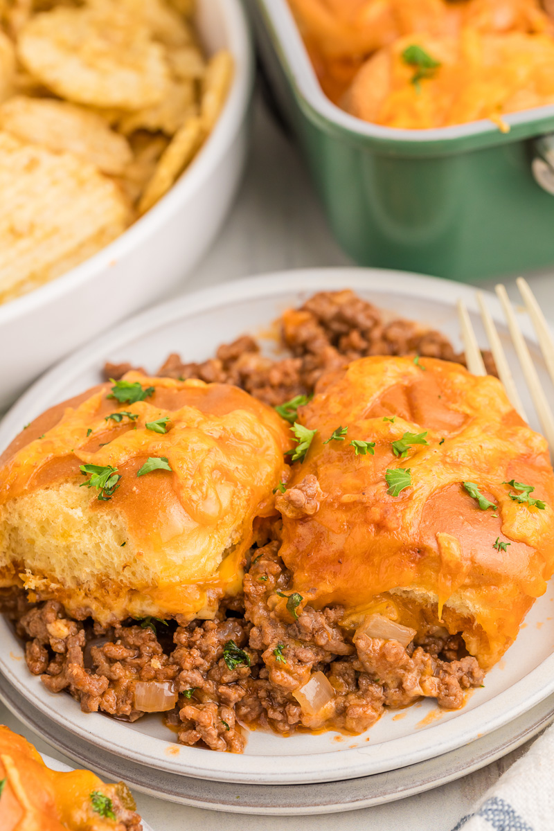 Sloppy Joe casserole with Hawaiian rolls served on a plate.