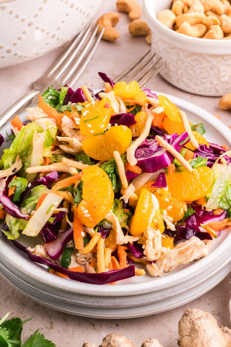 Asian chicken salad on a white plate.