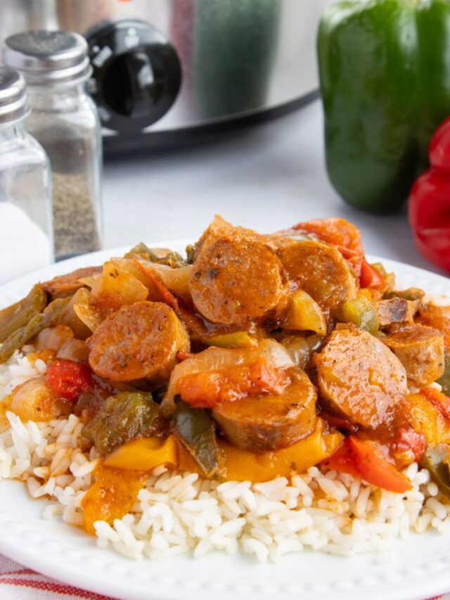 Crockpot sausage and rice on a white plate.