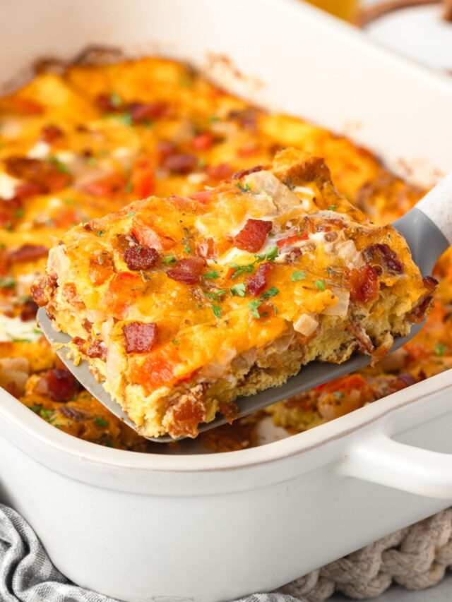 Bacon, egg and cheese casserole in a white baking dish.