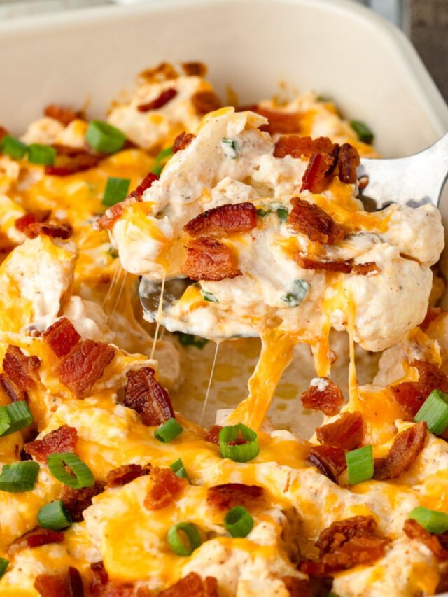 Loaded cauliflower casserole in white baking dish.
