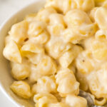 White cheddar macaroni and cheese in a white bowl.