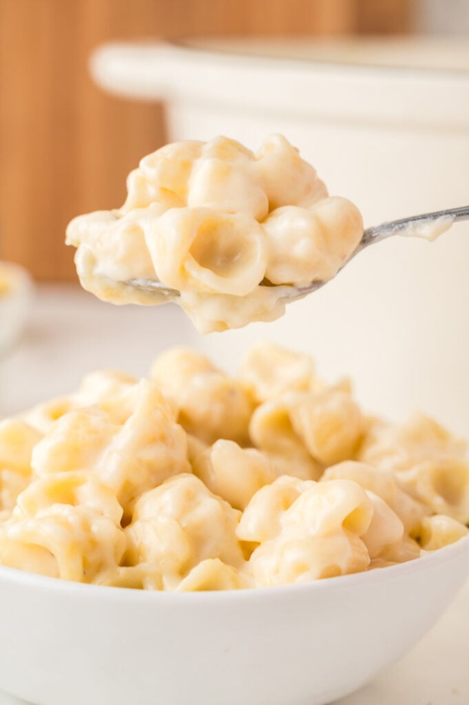 Panera copycat mac and cheese recipe scooped up on a spoon.