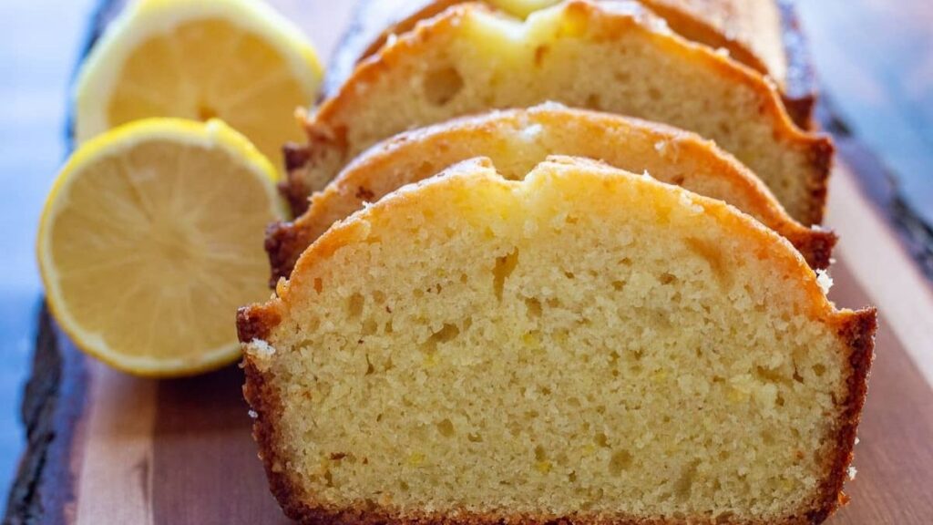 Lemon loaf cake on a wooden board.