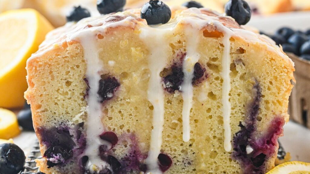 Blueberry lemon loaf cake on a white plate.
