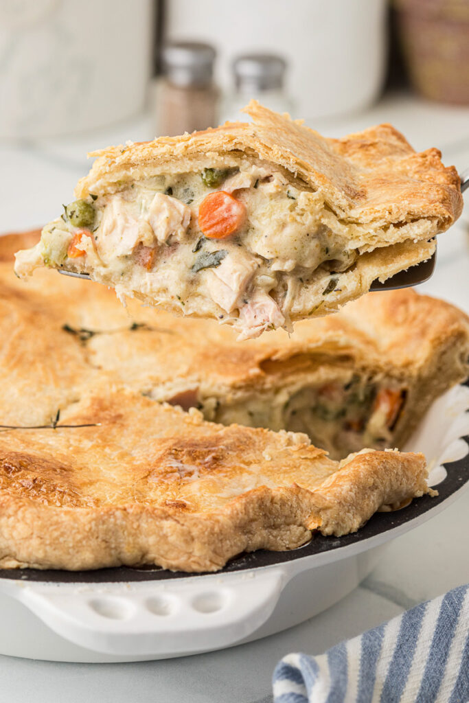 Chicken poe pie on serving spoon.