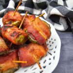 Bacon Wrapped Dilly Bites served on a white plate.