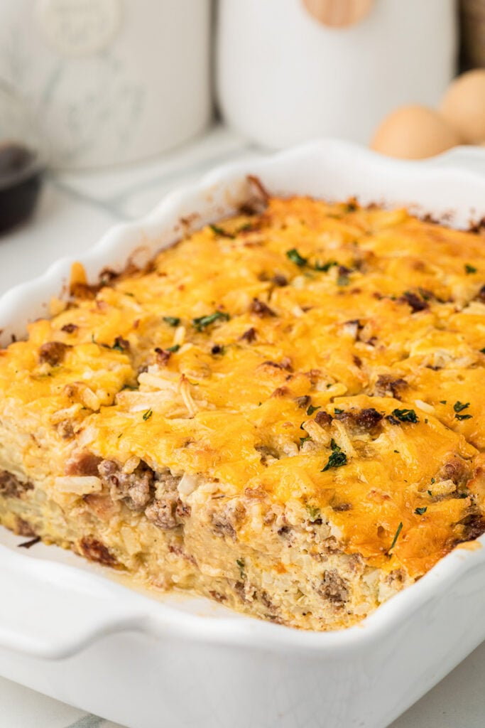 Hashbrown breakfast casserole in baking dish, ready for serving.
