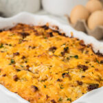 Breakfast casserole in white baking dish.