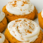 Pumpkin cookies on a white plate.