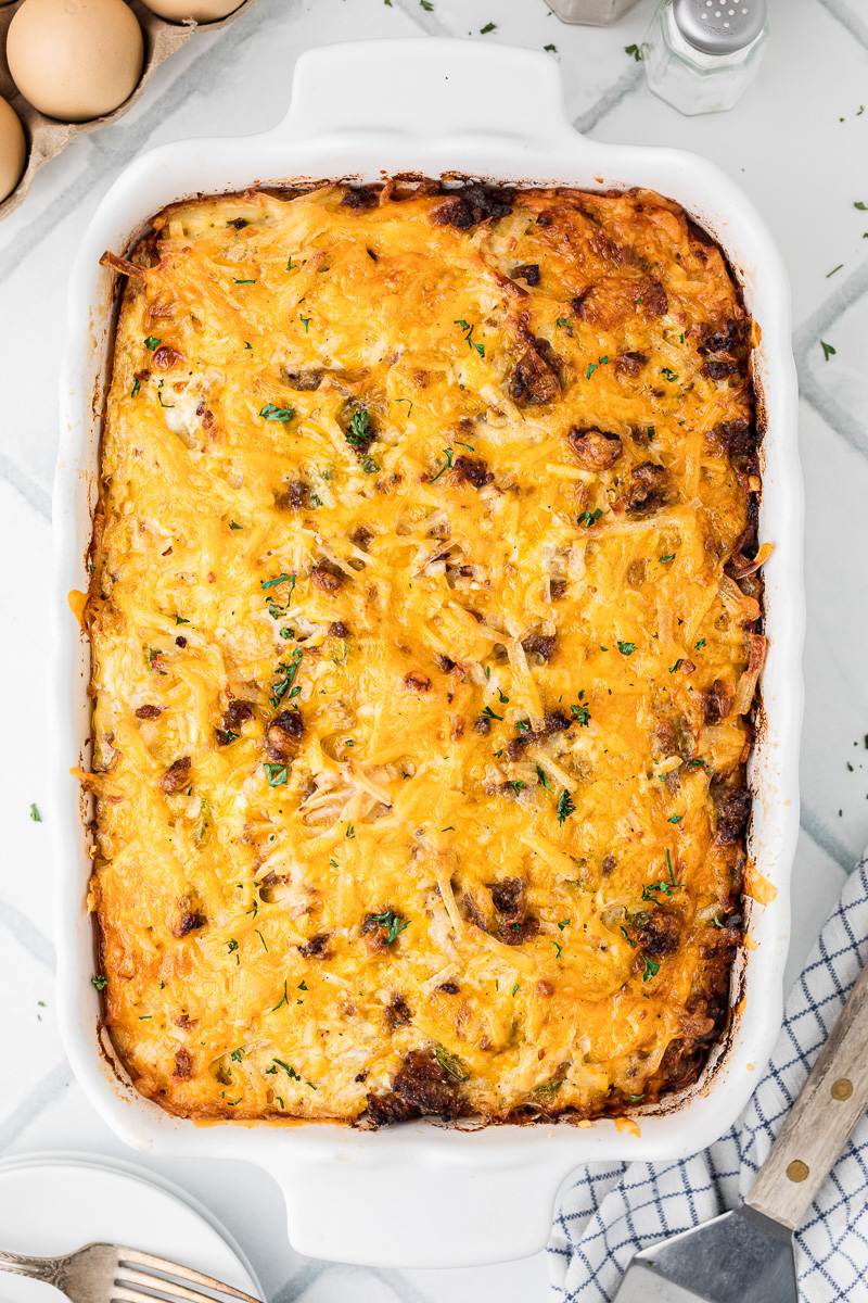 Overhead view of baked breakfast casserole with frozen shredded haashbrowns.