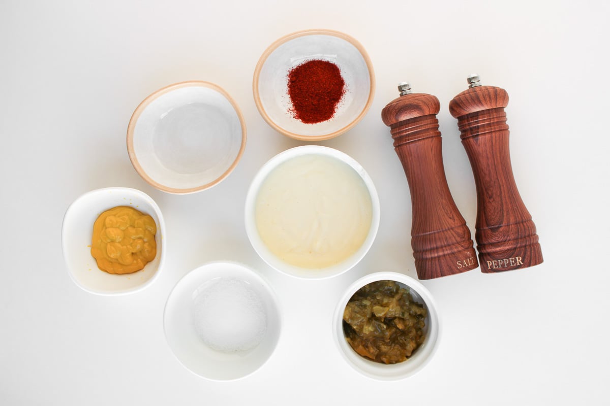 Big Mac sauce ingredients in small bowls on counter.