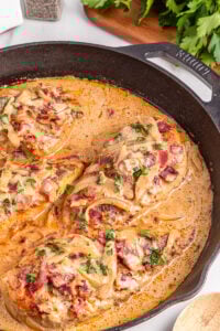 Smothered chicken in skillet.