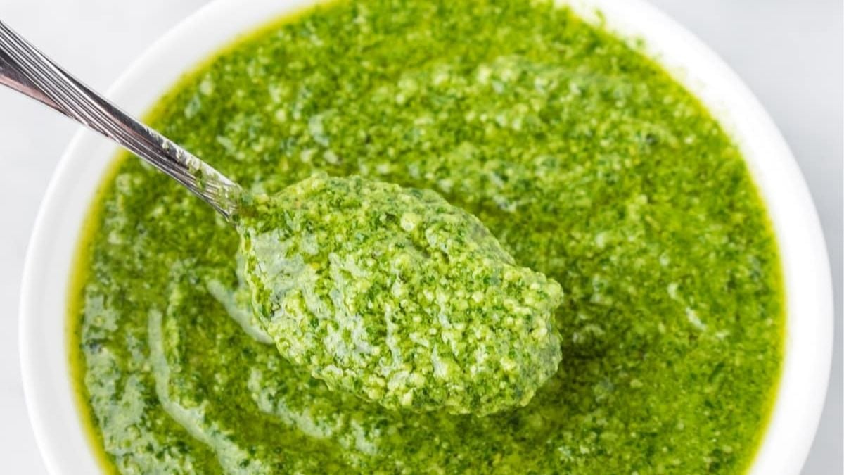 Homemade pesto in a white bowl.