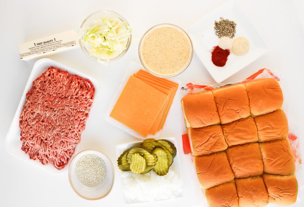 Big mac sliders ingredients in small bowls.