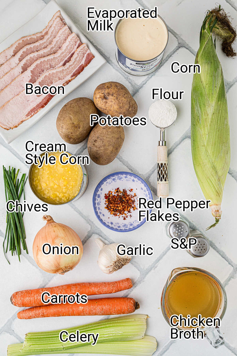 Ingredients for creamy corn chowder  in small bowls on counter.
