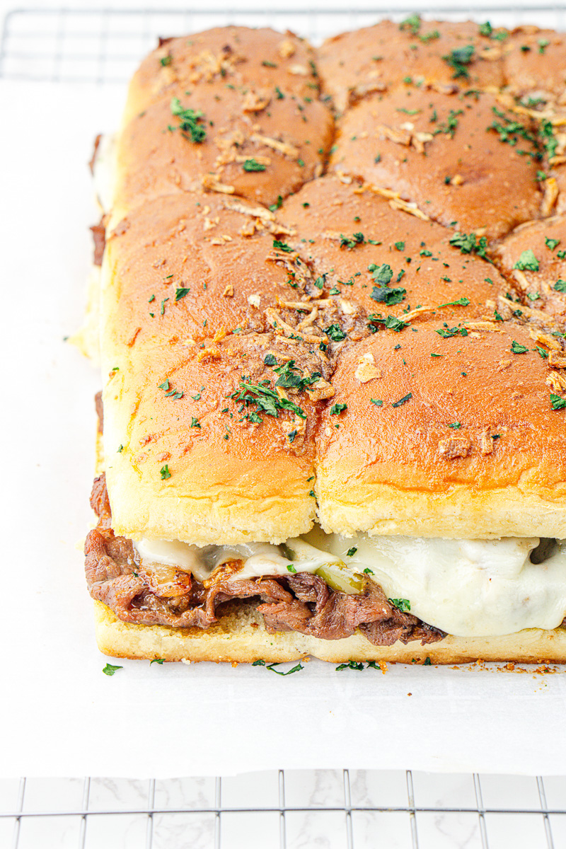 Finished dish of Philly cheesesteak Hawaiian roll slider.