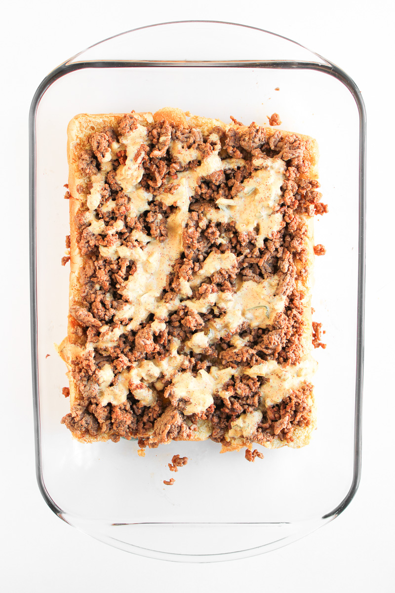 Big Mac sauce is spread on top of the groun beef mixture on the slider buns.