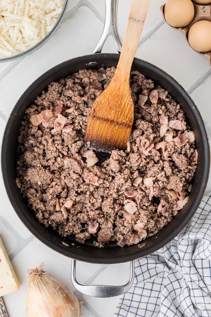 Cooke sausage in skillet.