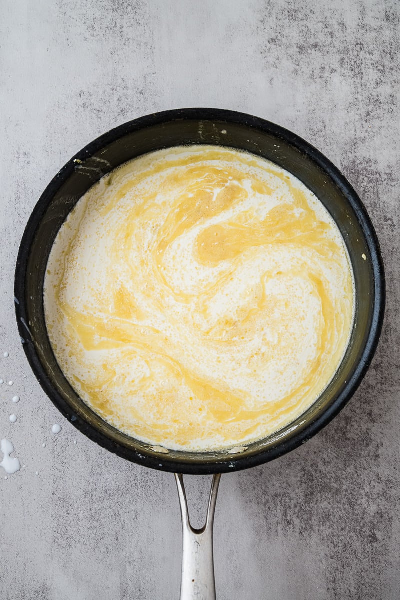 Cream is added to skillet.
