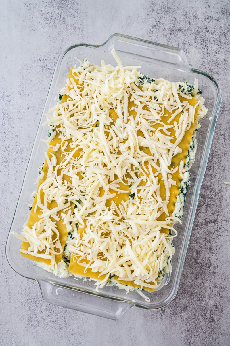 Noodles are toppe with remaining mozzarella.