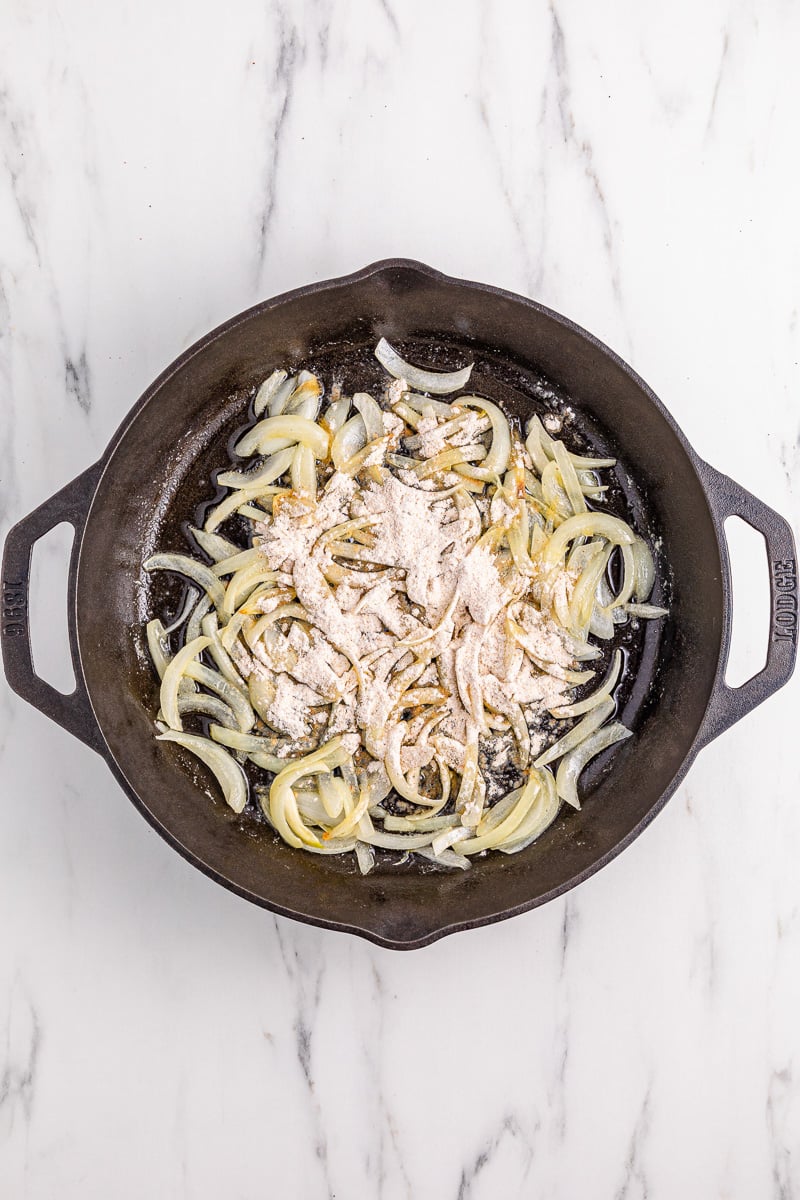 Onions cooking in skillet.