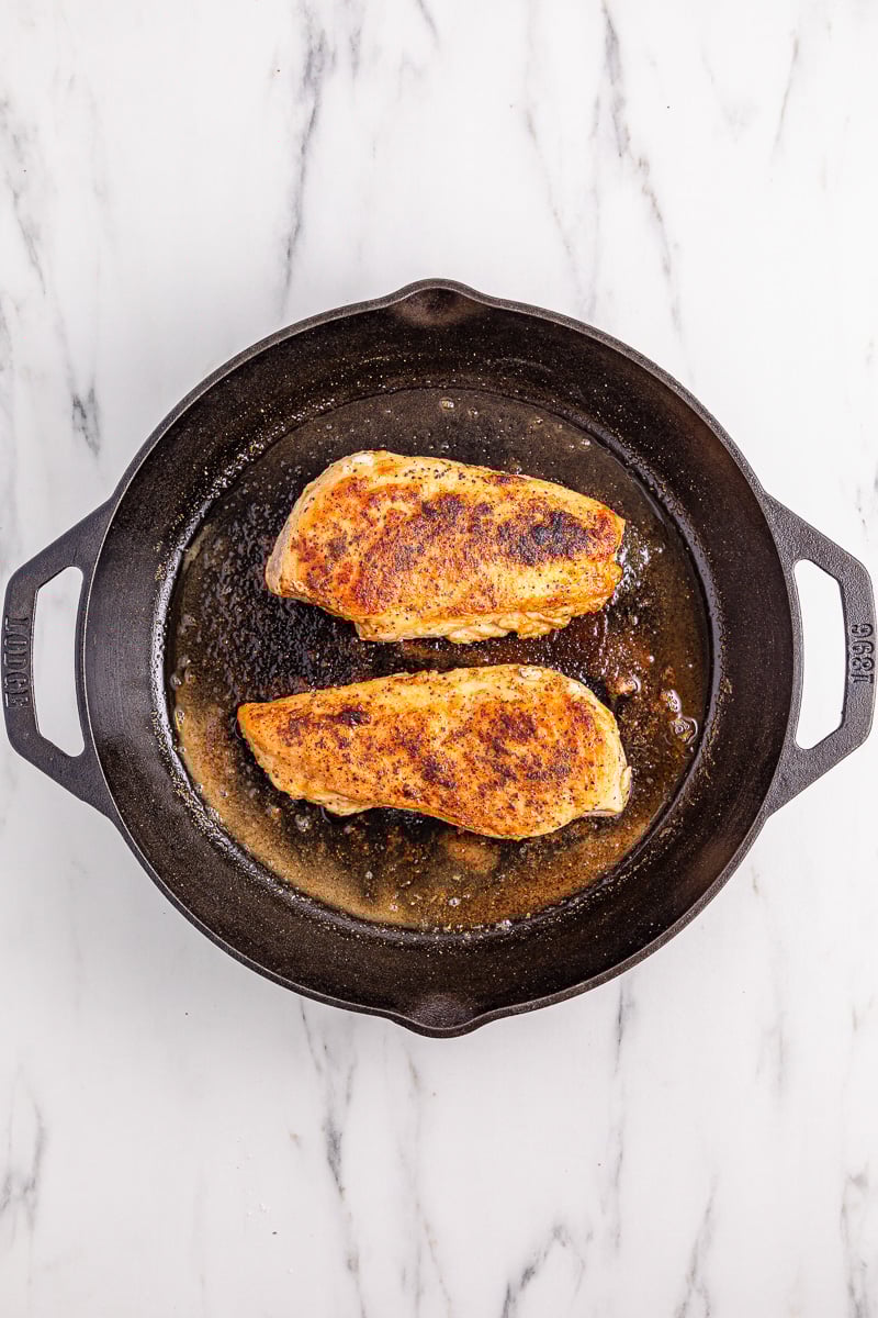 Chicken in cast iron skillet.