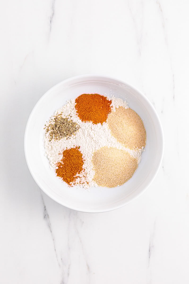 Flour with seasonings in bowl.