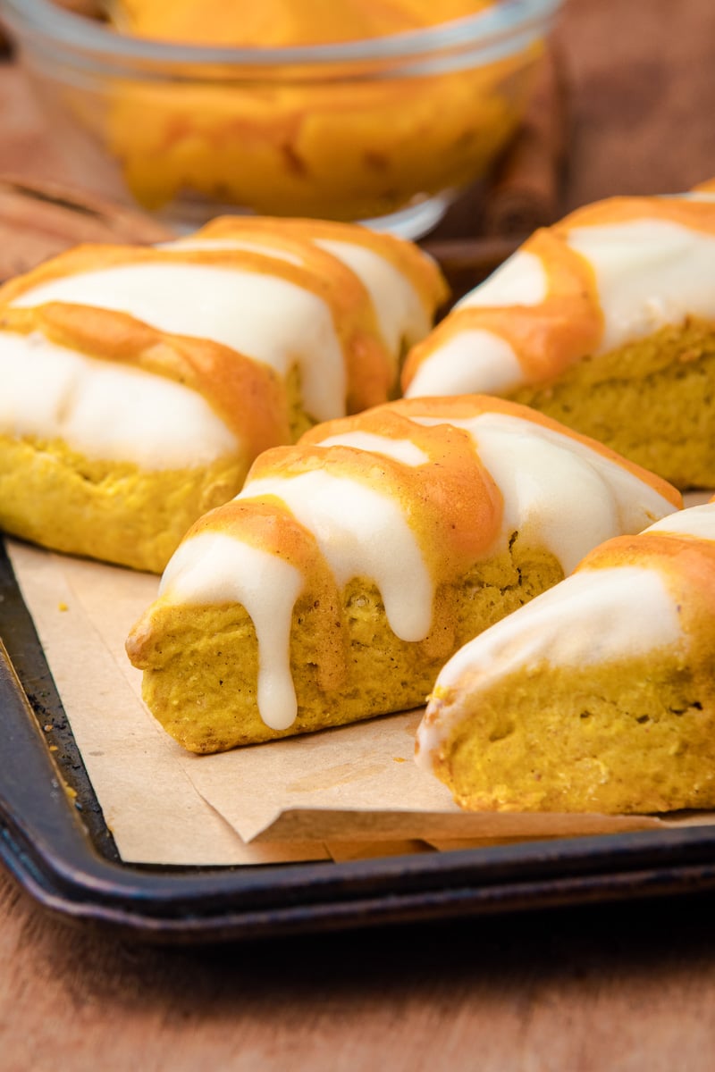 Pumpkin scones on parchment paper.