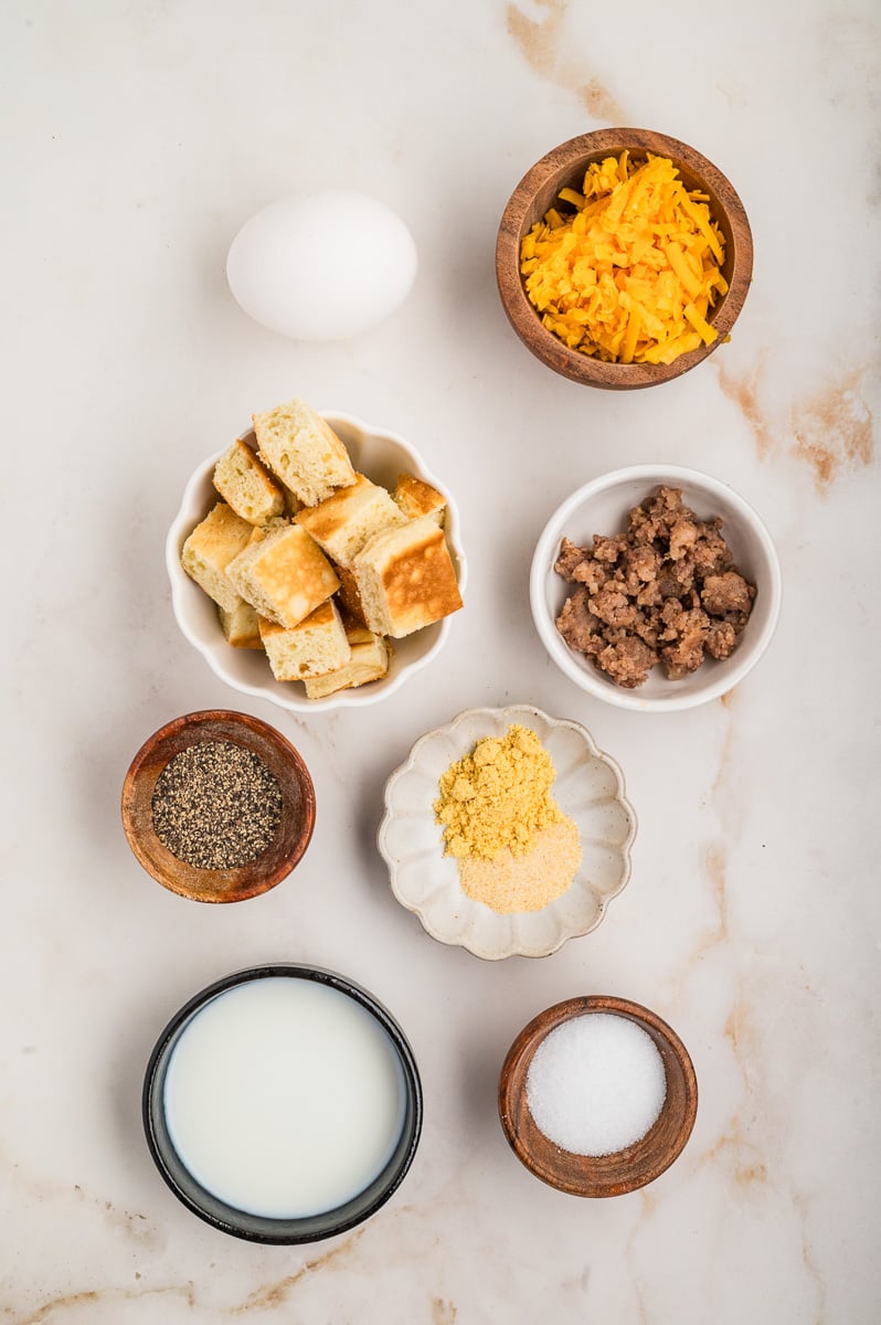 Ingredients for pancake casserole in small bowls on counter.