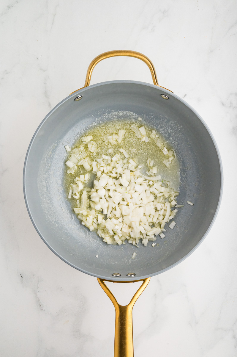 Butter and onions in skillet.