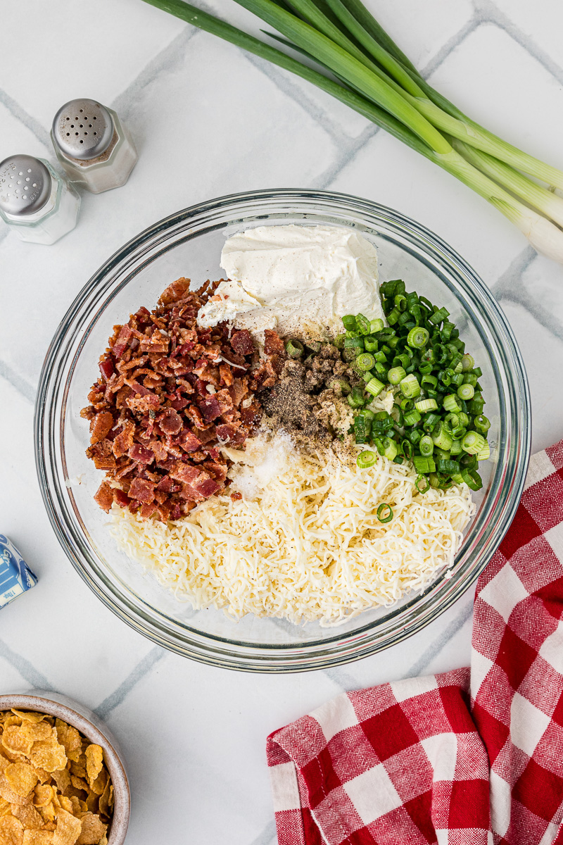 Ingredients for jalapeno popper filling in glass bowl.