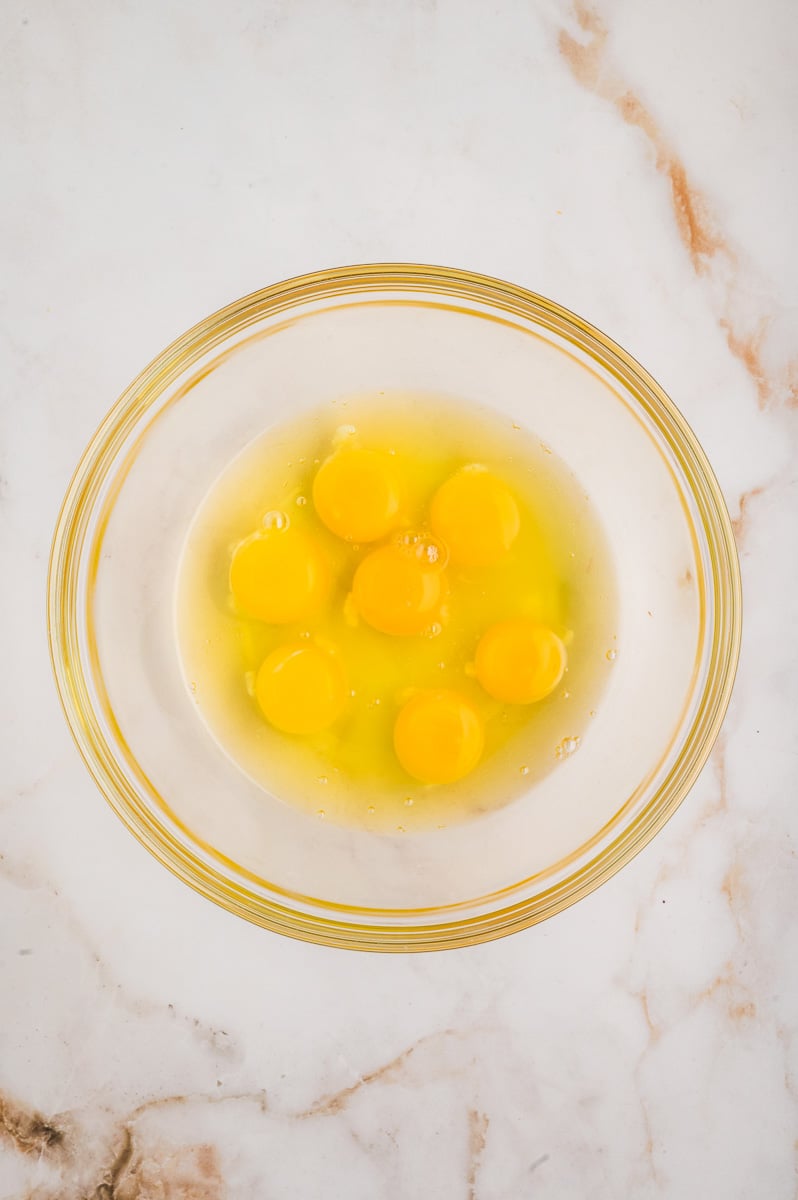 Eggs in mixing bowl ready to be whisked.