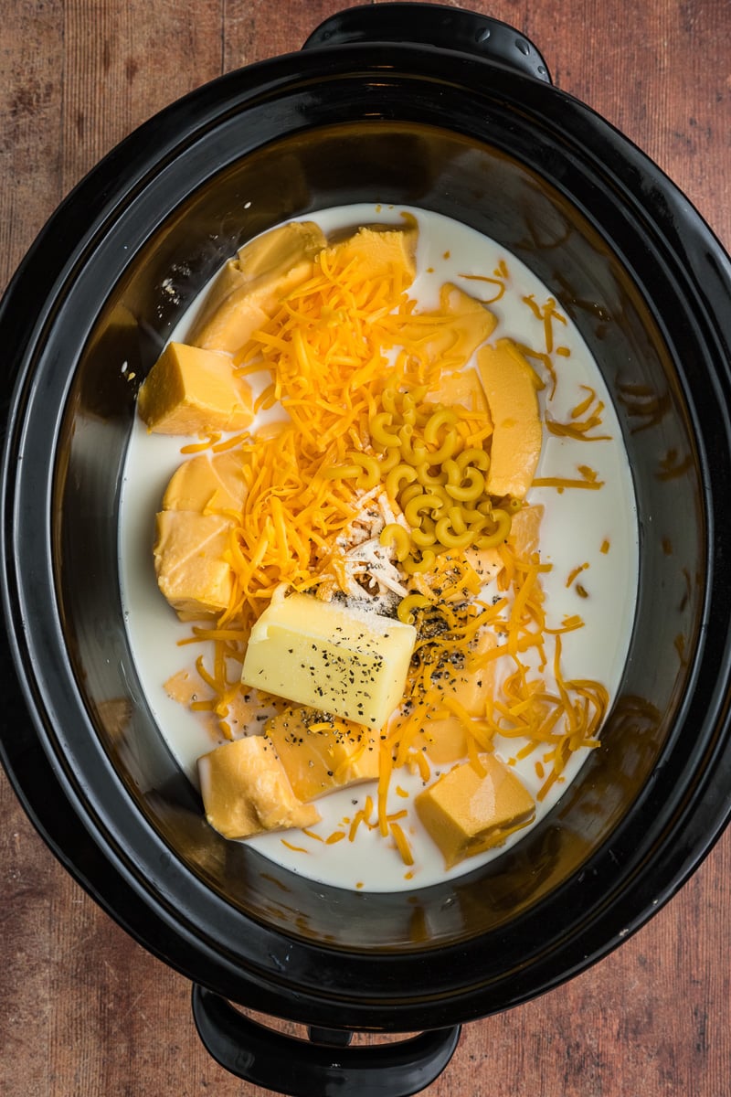 All ingredients for crockpot mac and cheese in slow cooker.