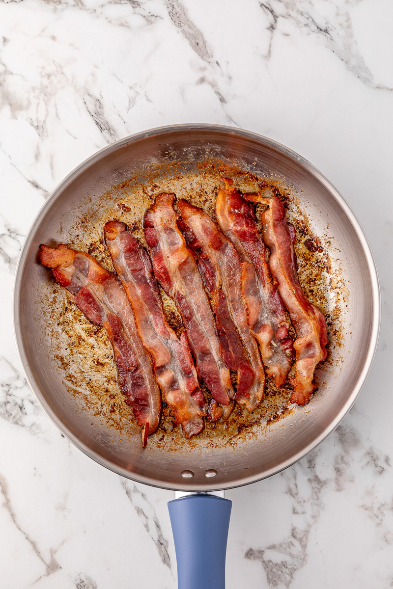 Bacon in a skillet.