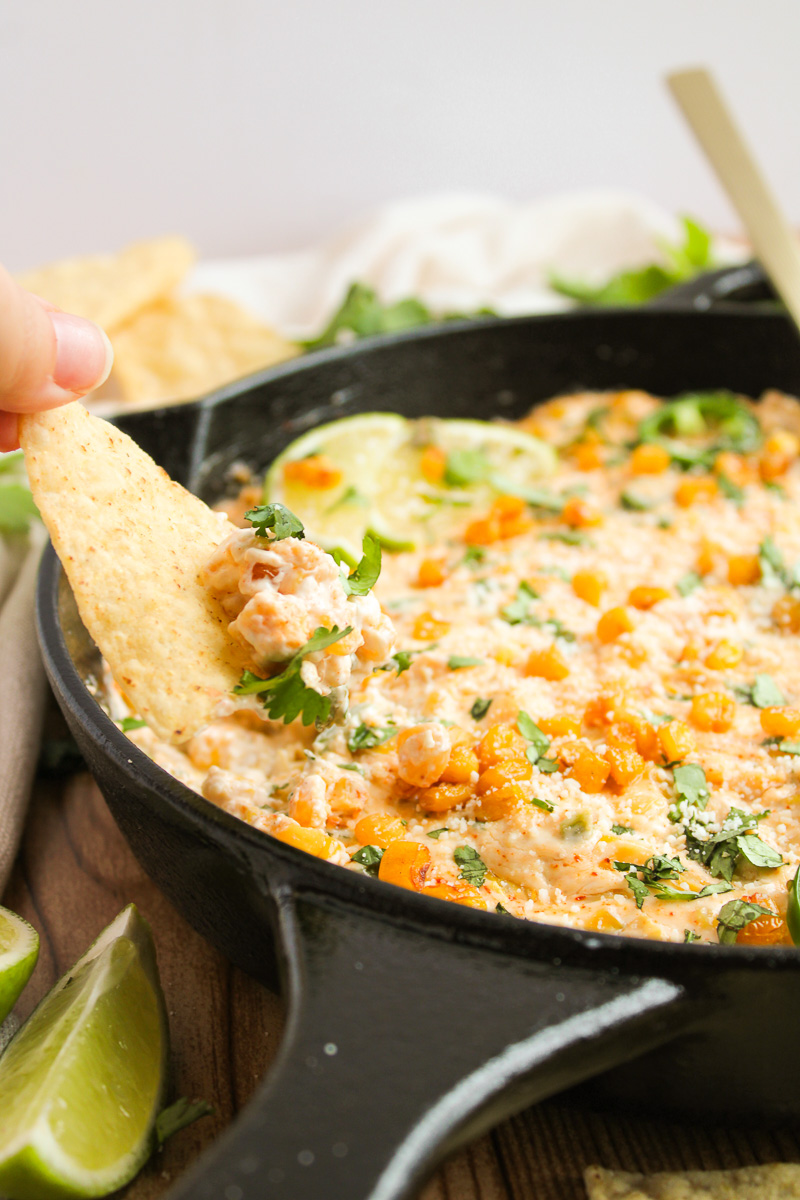 Mexican street corn dip in cast iron skillet.