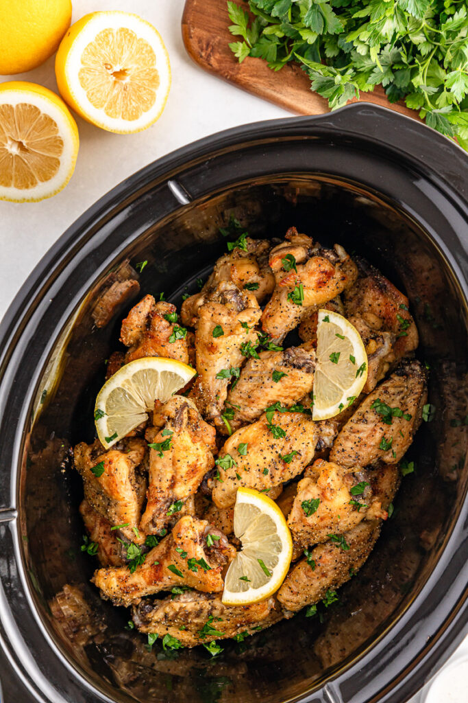Lemon pepper chicken wings in crockpot.