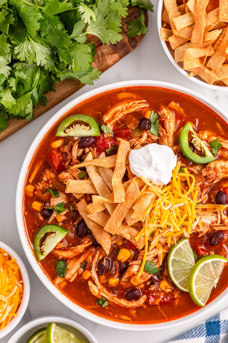 Chicken tortilla soup in a white bowl.