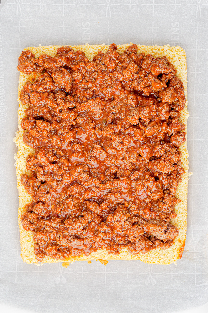 Meat mixture is spread on Hawaiian roll sliders buns.